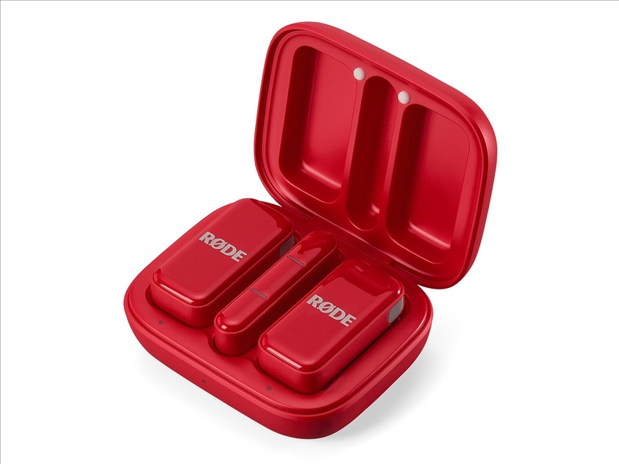 Red dual-channel wireless microphone system for USB-C phones and tablets with automatic GainAssist and charging case.