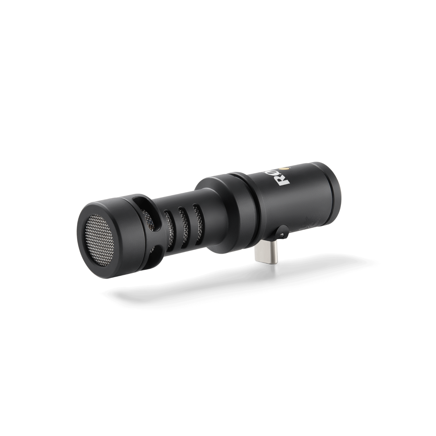 Compact directional USB-C microphone for smartphones and tablets with headphone output and complete accessories.