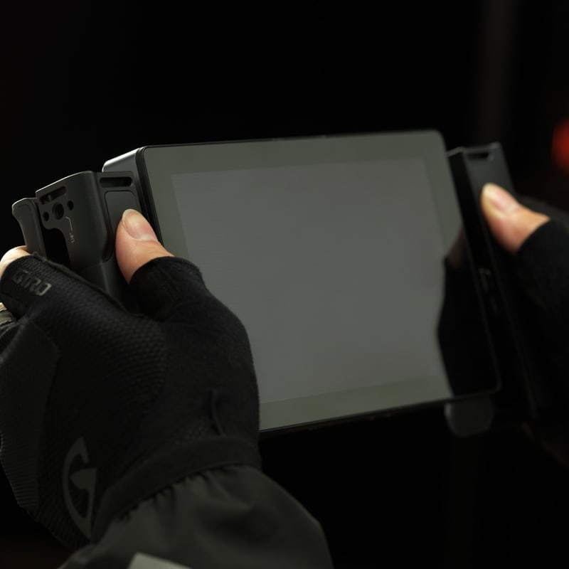 Two hands on the monitor
